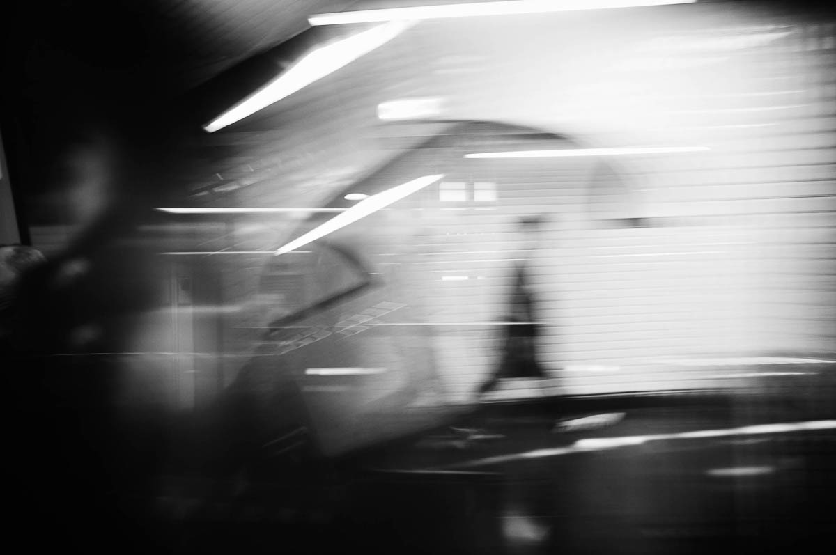 The blurred silhouette of a man walking in the corridors of the Paris metro, from the series Going Underground by Emmanuel Pineau