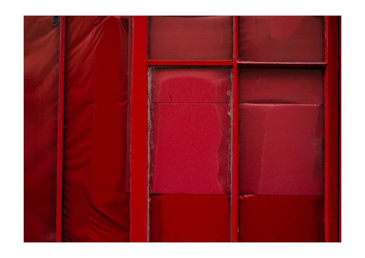 A completely red shop window, from the series I will be around by Emmanuel Pineau