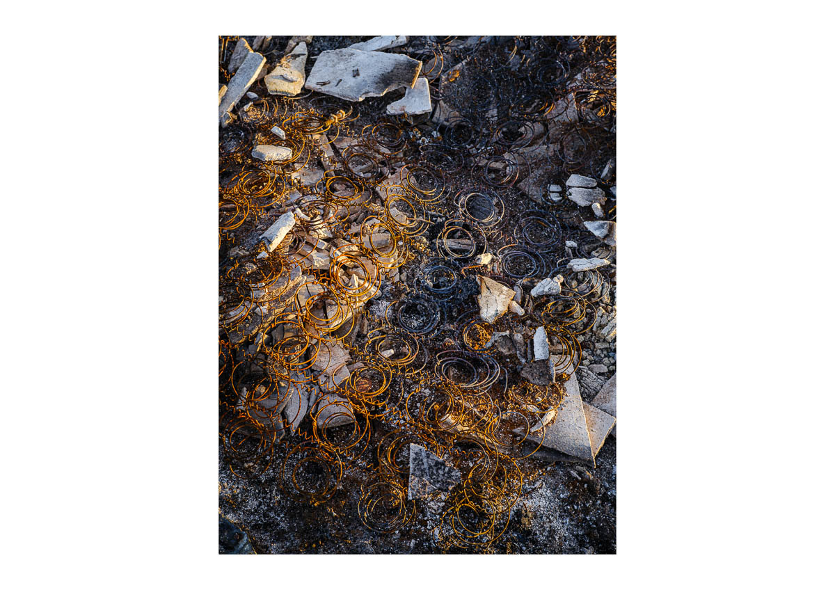 Abstract close-up of the remains of a rusty bed frame in an illegal dump, from the series I will be around by Emmanuel Pineau
