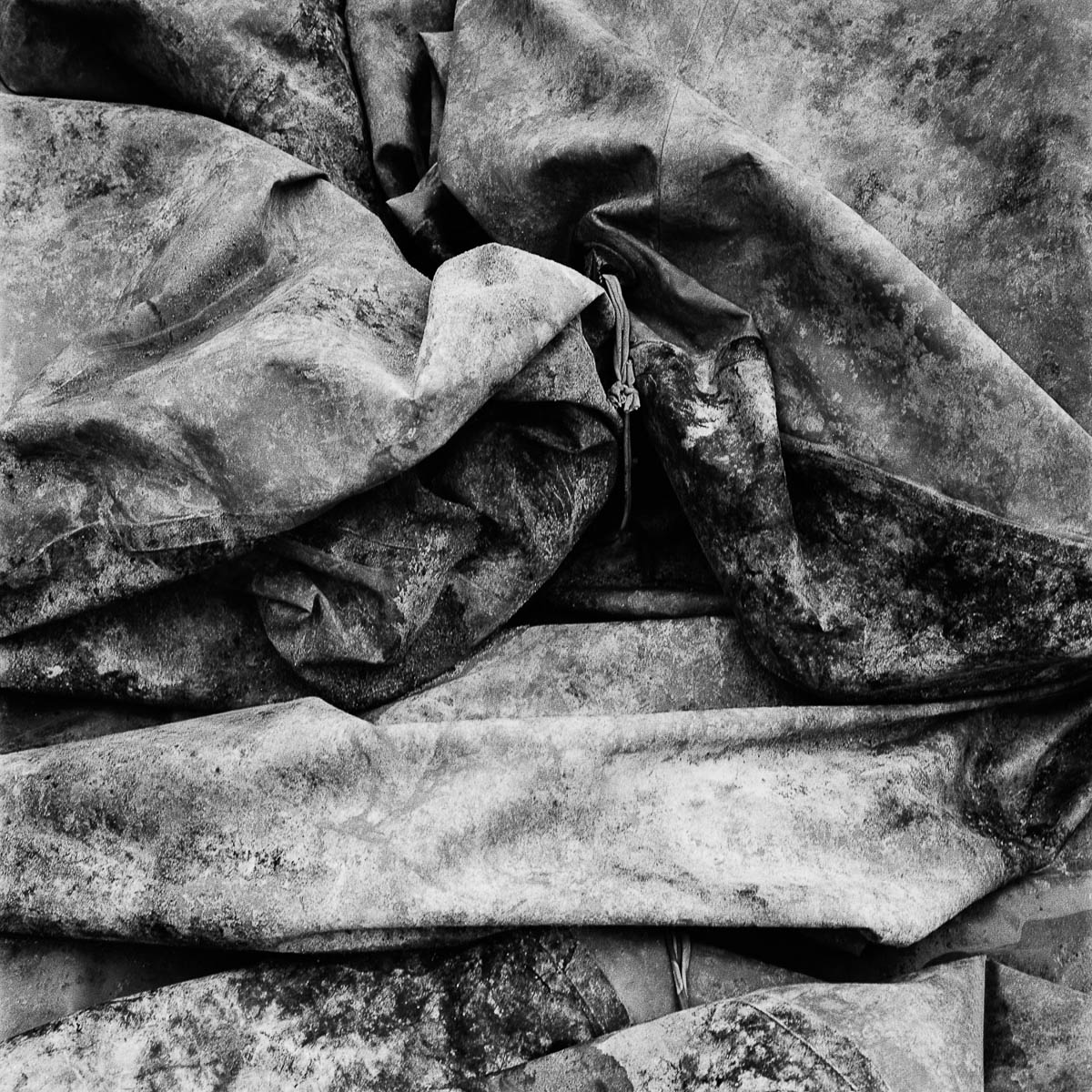 Abstract composition with a close-up of a dirty construction site canvas, from the series Les limites du territoire by Emmanuel Pineau