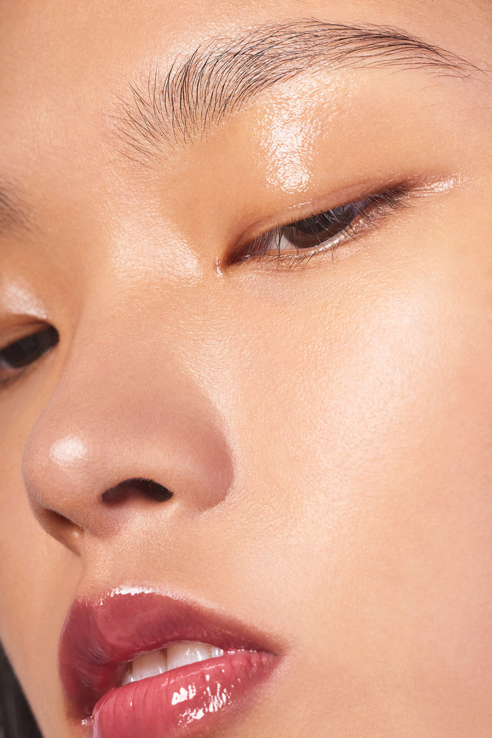 Close up of a Asian model's face with natural skin texture by Sophie Delaporte