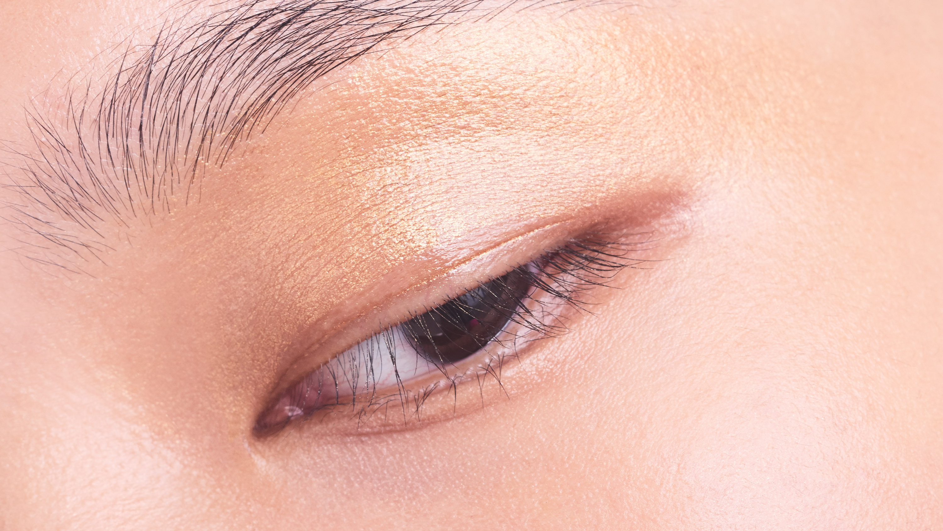 Close up of an Asian model's eye by Sophie Delaporte