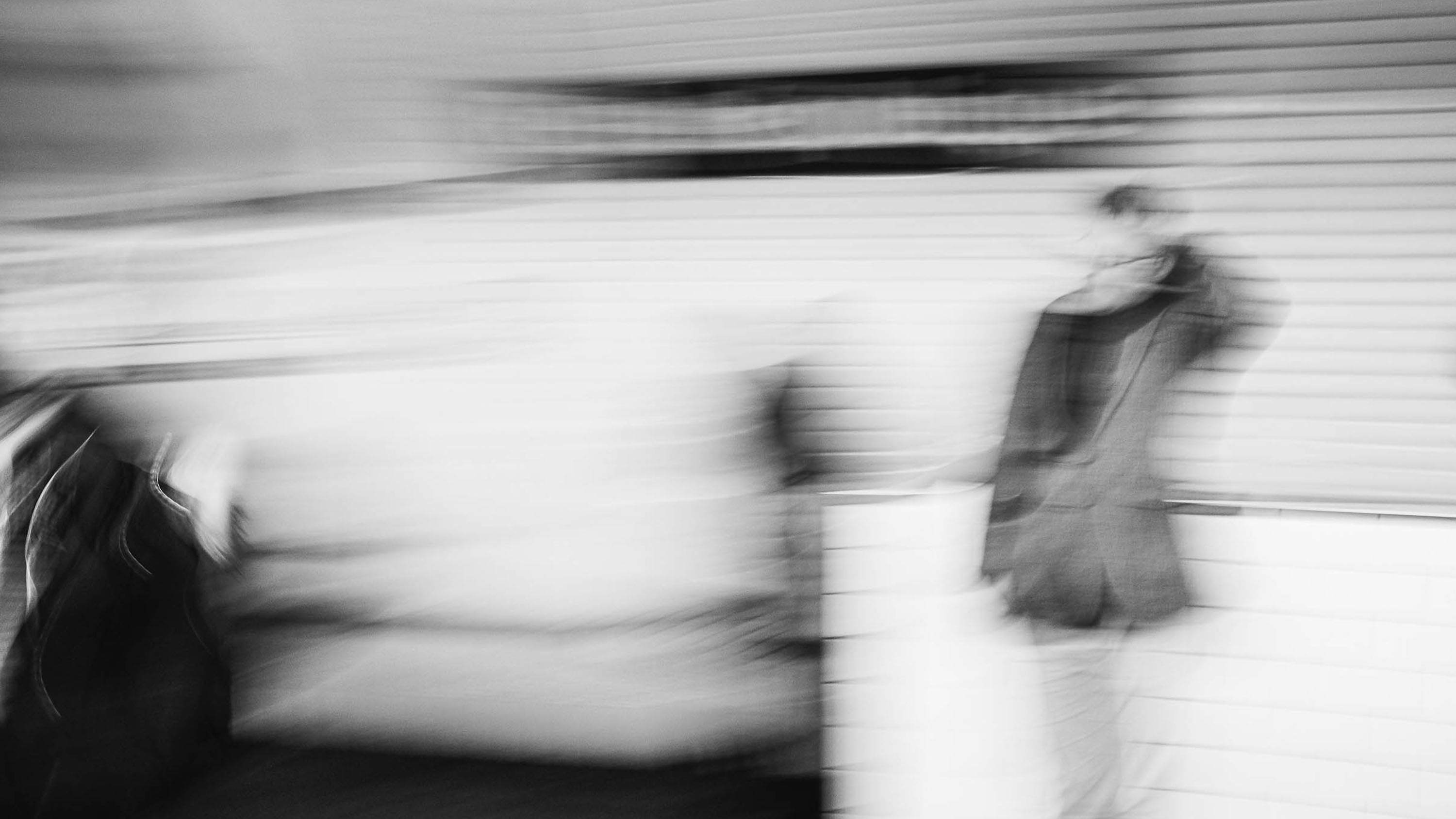 The blurry silhouette of a man waiting on the platform of the Paris metro, from the series Going underground, by Emmanuel Pineau