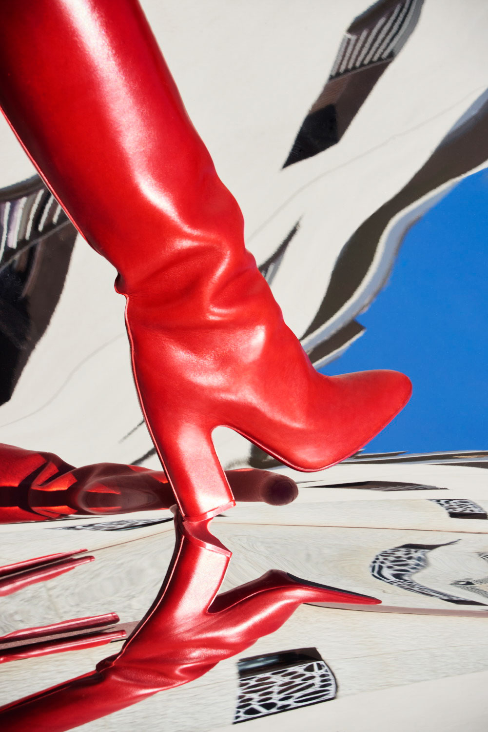 Red boots by Louis Vuitton, photography by Sophie Delaporte