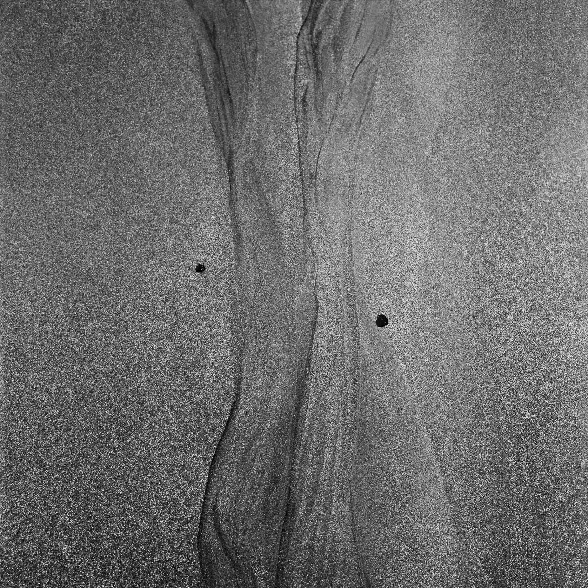 Abstract composition, traces in the sand on a beach, from the series One piece of my mind by Emmanuel Pineau
